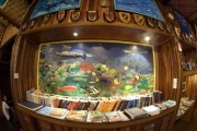 There is a small library corner at the dining area with fish identification reference materials.