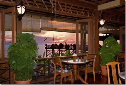 Dining hall with open sea views.