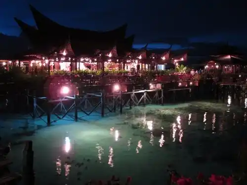 Mabul Water Bungalows at dusk.