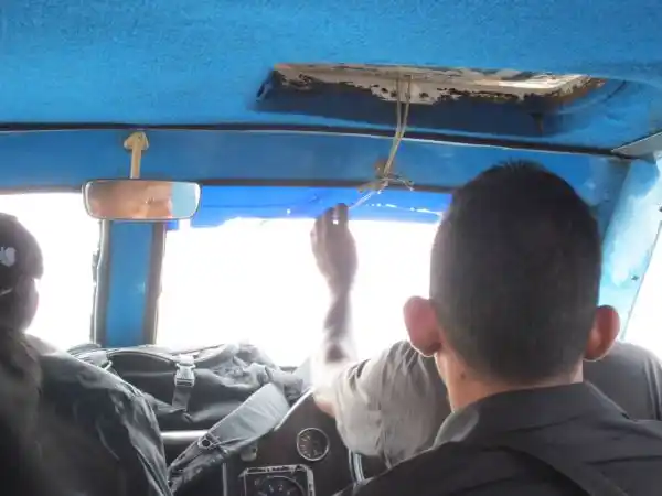 A manually operated windscreen wiper on the ferry.