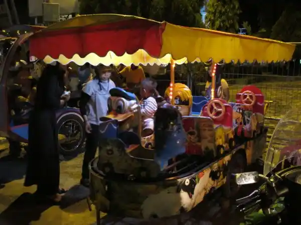The pedal-powered merry-go-round, Nunukan town square.