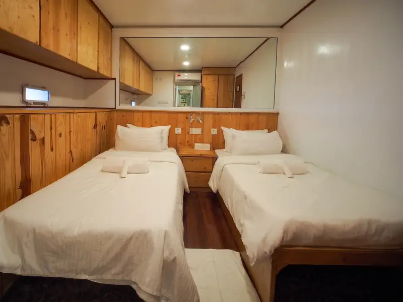 Well-appointed interior with air-conditioning and attached bathroom.