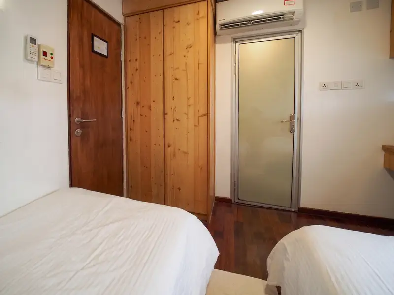 Practical layout with a dressing table and comfortable bedding.