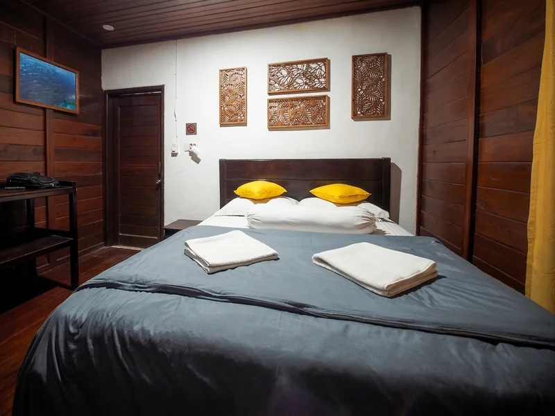 High-ceilinged chalet interior with modern amenities and local design touches.