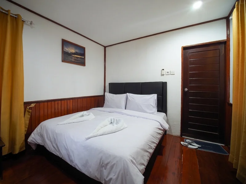 Clean and cozy standard room layout designed for a relaxing stay after diving.