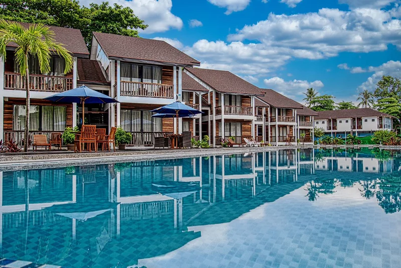 The elevated two-storey villa blocks are set back from the beachfront for added privacy.