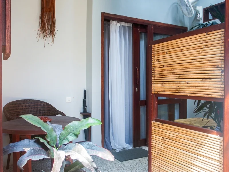 Traditional Indonesian architecture renovated into boutique lodging, featuring private terraces.
