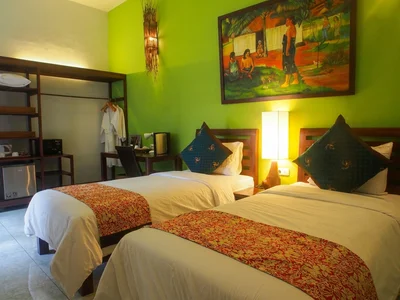 Large Deluxe Room featuring a comfortable king-size bed and airy layout.
