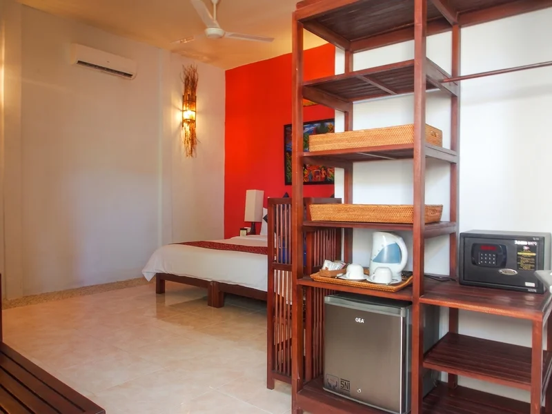 Bright and spacious bedroom area in the Super Deluxe room.