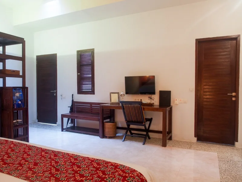 Detailed view of the furnishings and open-air shower access in the Super Deluxe category.