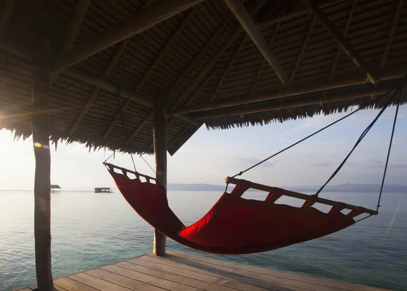 Private Deluxe balcony offering unobstructed views of the Raja Ampat reefs.
