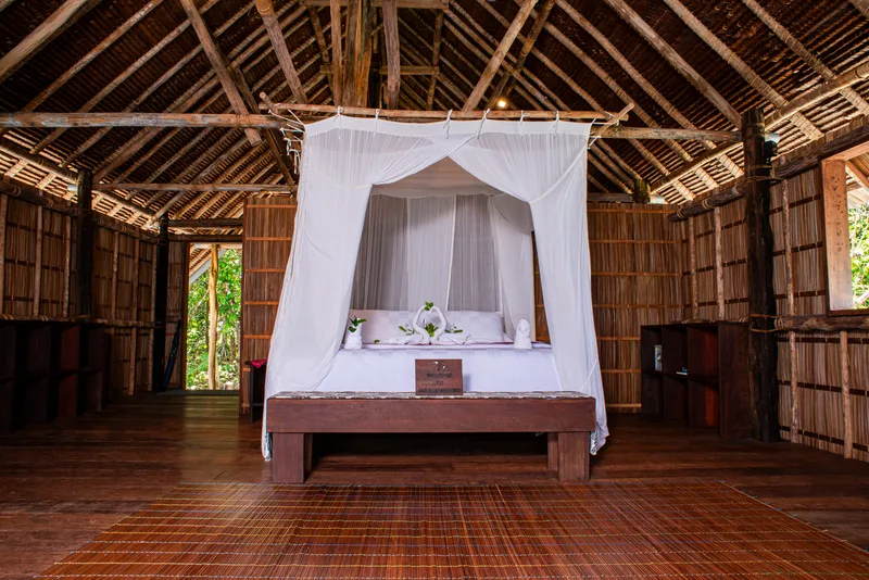 Spacious and well-appointed bedroom area in the largest cottage category.