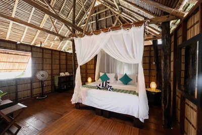 Traditional over-water cottage interior featuring locally sourced Papuan timber.