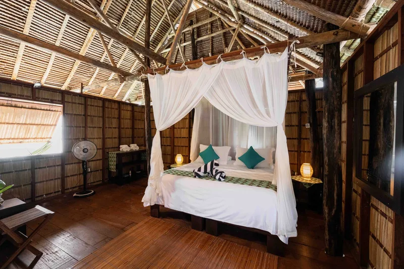 Traditional over-water cottage interior featuring locally sourced Papuan timber.
