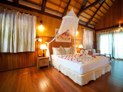 Cozy Beach Chalet interior with local wooden finishes and air-conditioning.