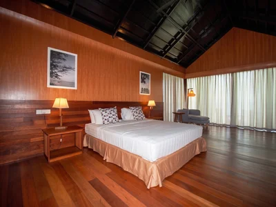 Secluded Water Chalet interior with high ceilings and tranquil atmosphere.