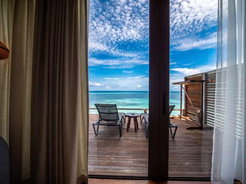 Panoramic sea views from the private balcony of a Water Chalet.
