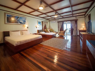 Elegant wooden interior of the signature water bungalow.