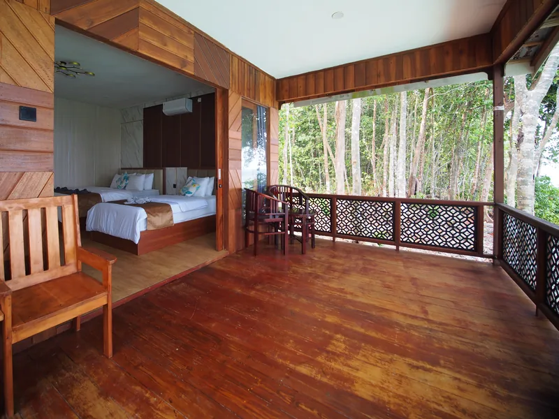 Private veranda with outdoor seating, opening onto the bedroom.