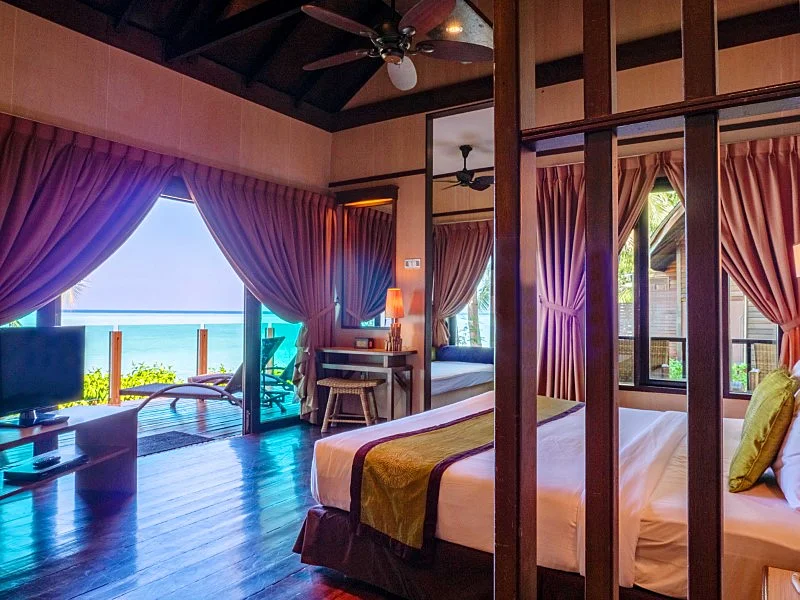 Elegant standalone beach cottage nestled along the shoreline.