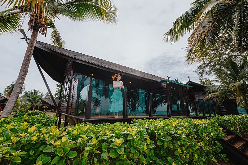 Beachfront bungalow set right on the white sandy shore.