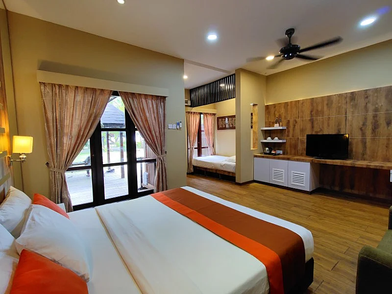 Garden View Deluxe (West) room interior featuring local wooden finishes.