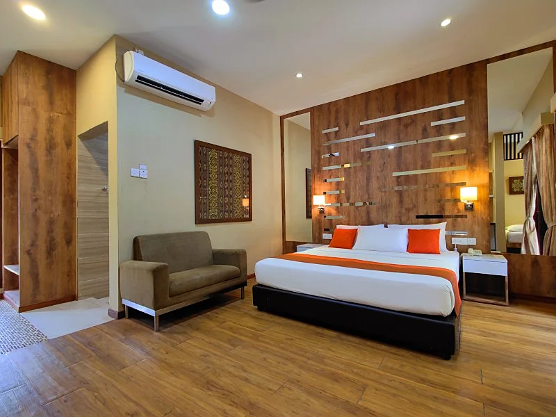 Comfortable master bed with traditional charm in the Garden View West room.