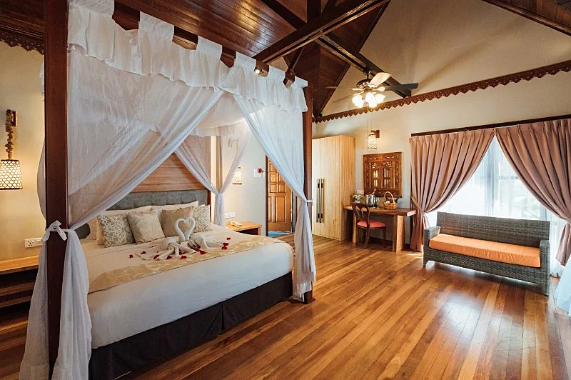 Comfortable king-size bed in the private standalone bungalow.