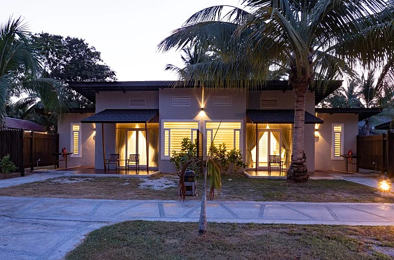 Exterior view showing the traditional linked bungalow structure.