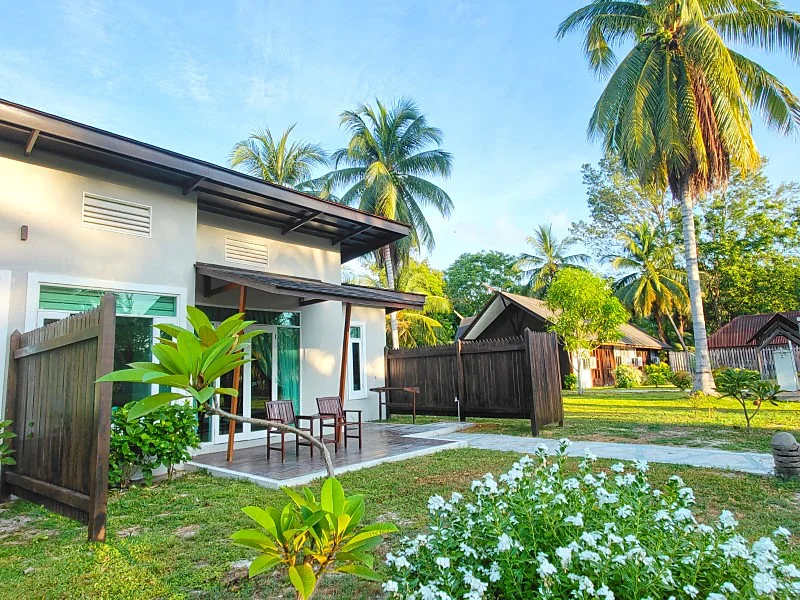 Private sun deck overlooking the resort's exotic gardens.
