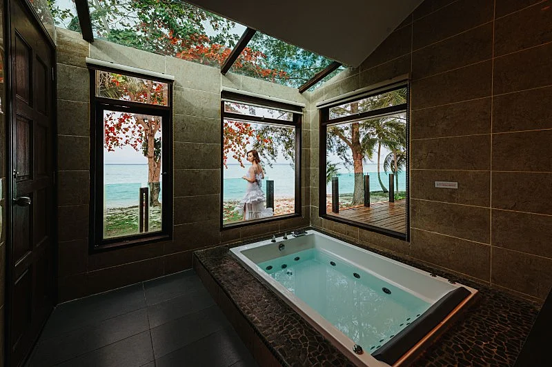 Beachfront semi-detached chalet featuring a private overwater jacuzzi.