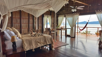 Large Deluxe Water Cottage interior, beautifully crafted from sustainable local wood.