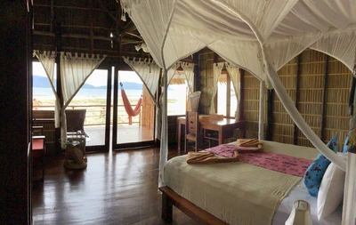 Traditional Papuan-style interior of the Superior Water Cottage.