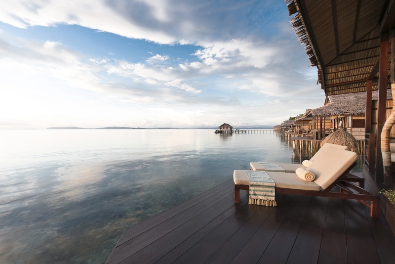 Two-tier sunset veranda with daybed and hammocks for ultimate relaxation.