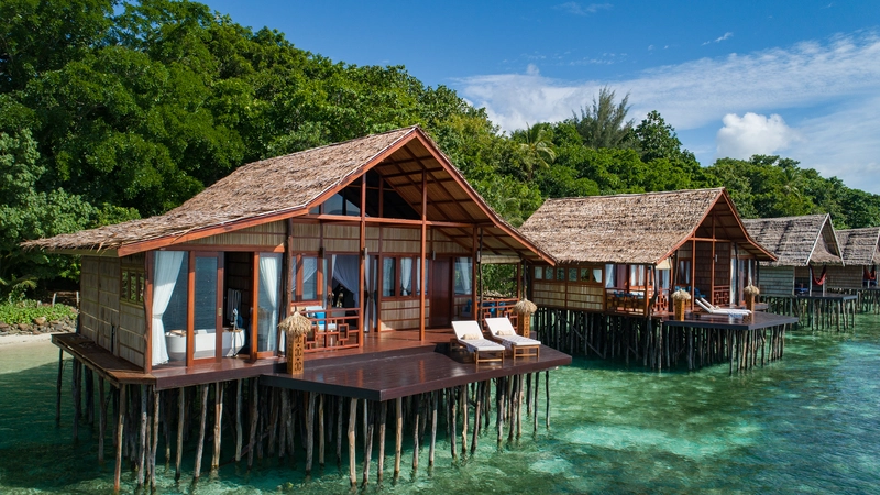 The exclusive Premiere over-water bungalow standing gracefully over the reef.