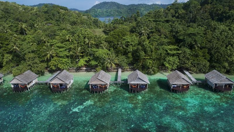 A row of Superior bungalows gazing out to the Raja Ampat reef.