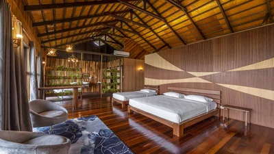 Spacious chalet interior featuring a clean, modern design and high ceilings.