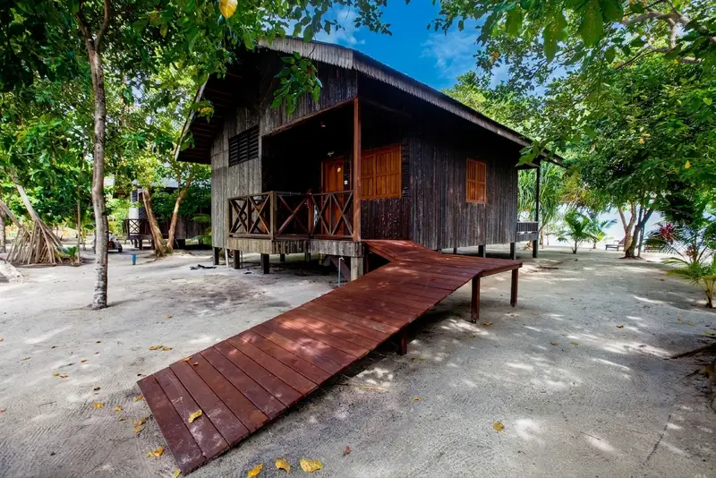 Premium Beach Villa hidden among tropical trees directly on the shore.