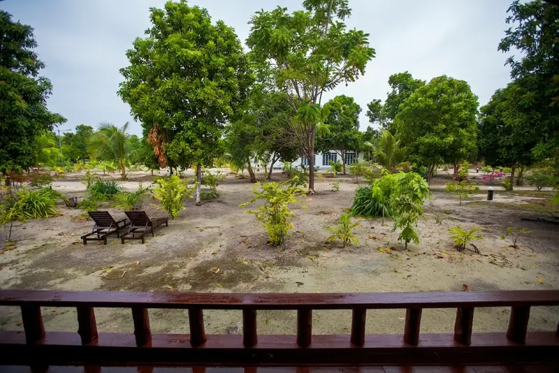 Private balcony overlooking the resort's lush tropical gardens.