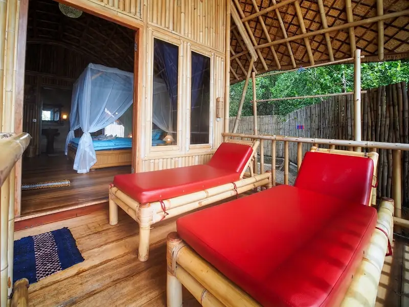 Beachfront bamboo cottage positioned directly on the foreshore with unobstructed sea views.