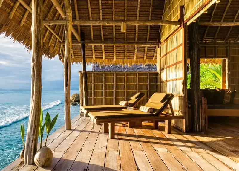 Large private deck with sun loungers and a hammock, perfect for relaxing over the water.