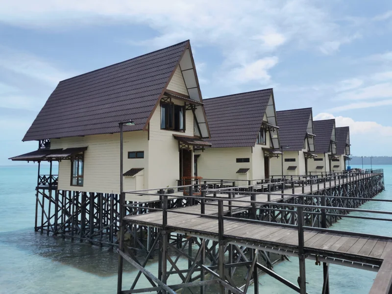 The grand over-water structure of the Kakaban Villa on Sidau Island.