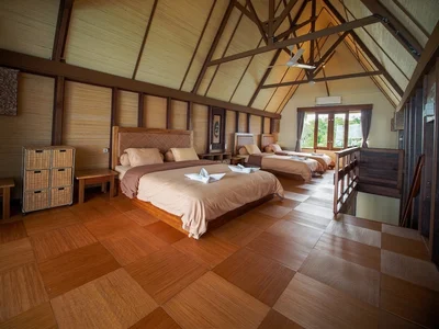 Luxurious master bedroom in the Kakaban Villa with stunning lagoon views.