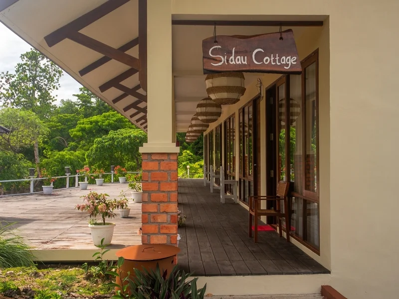 Private Sidau Cottage exterior set right on the white sandy beach.