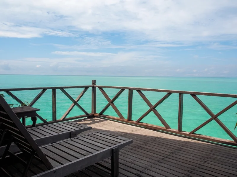 Private over-water balcony offering direct sea views and ocean breezes.
