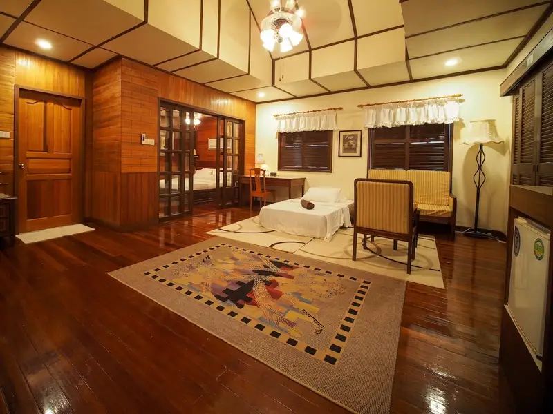 Separate living room area in the suite, offering extra space and comfort for groups or families.