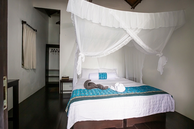 Cozy beachfront standard room interior with a pleasant sea breeze.