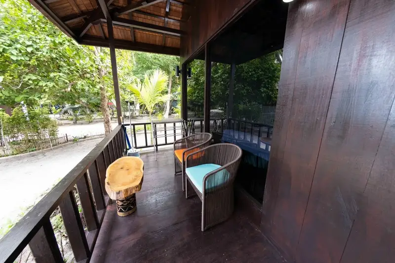 Private balcony offering peaceful views of the surrounding tropical greenery.