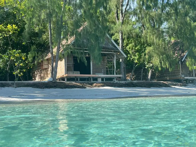 Traditional beach cottage built with local wood and Papuan architectural style.