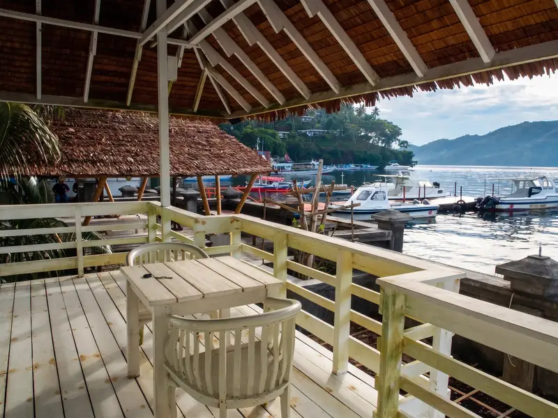 Expansive private balcony directly overlooking the white sand beach.